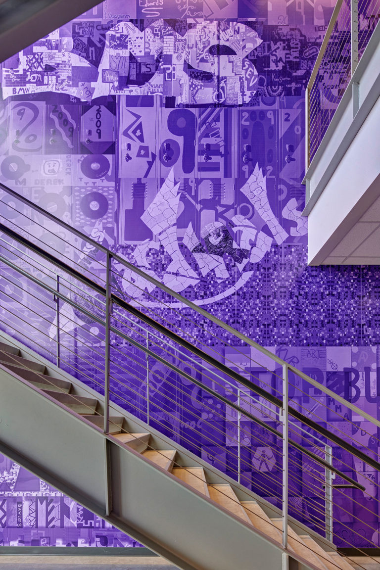 Purple mural wall graphic in stairwell