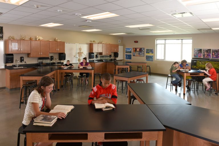 Science classroom with students reading