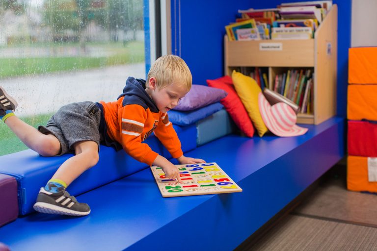 Boy using readying/play ledge