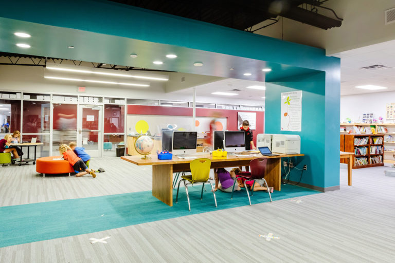 Media center featuring blue floor and ceiling elements