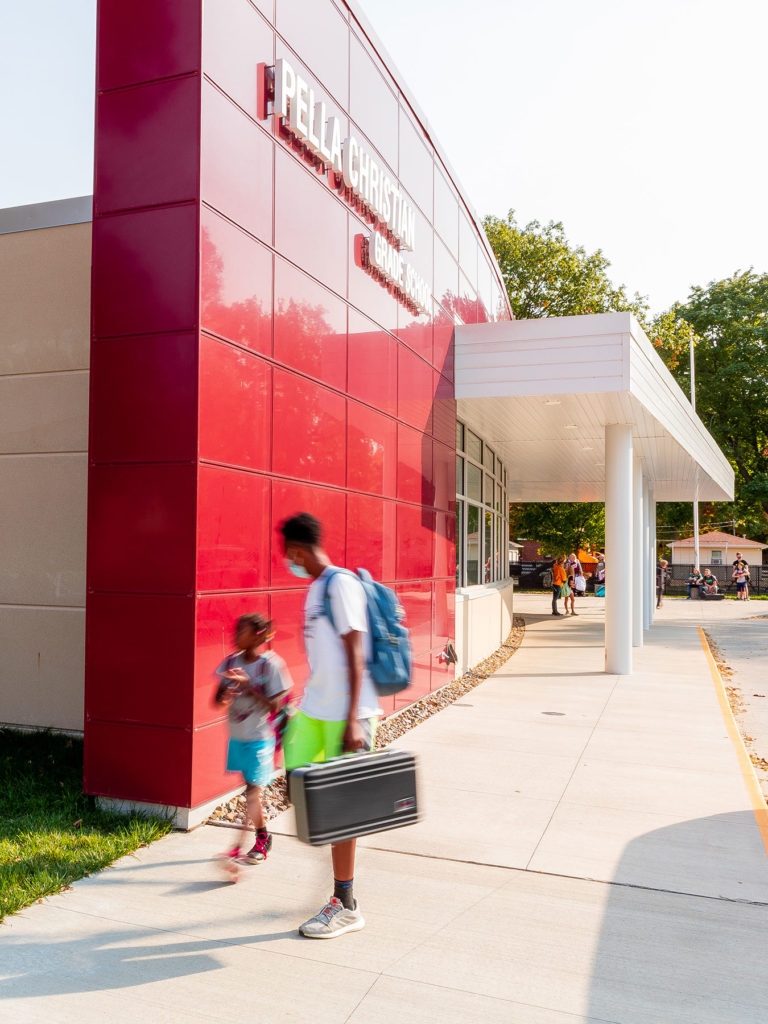 Exterior featuring curved red metal wall panels