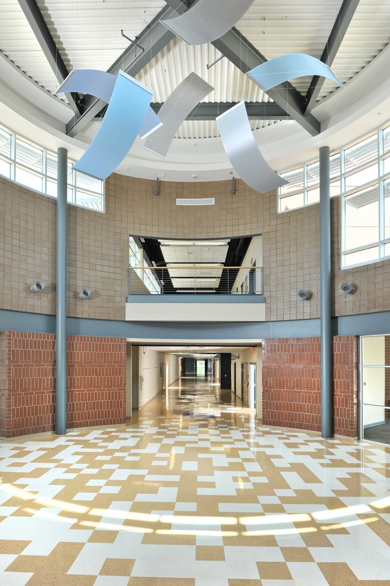 Interior main entry with ceiling-hung art