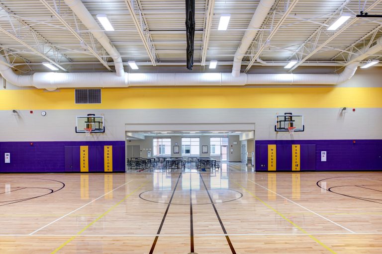 Gymnasium with entrance into cafeteria