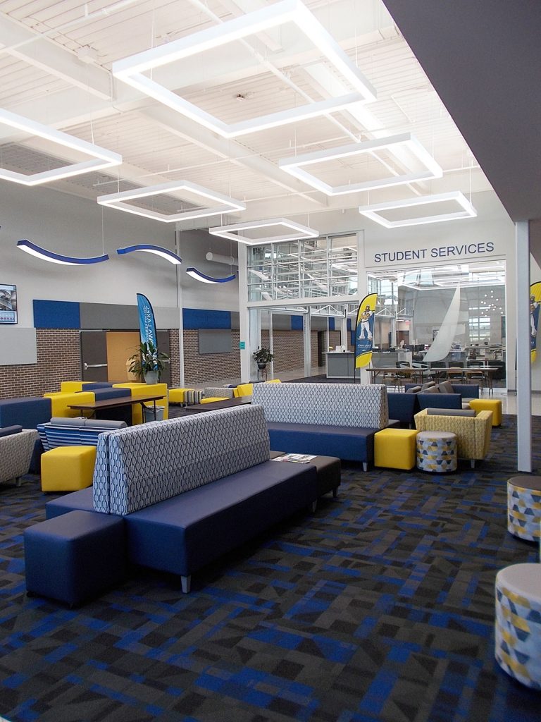 Lobby highlighting soft seating and square lights