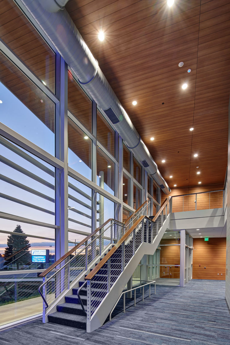 Architectural staircase looking out curtainwall glass