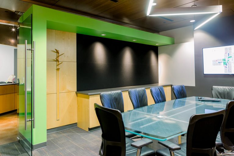 Conference room with large glass table and chairs