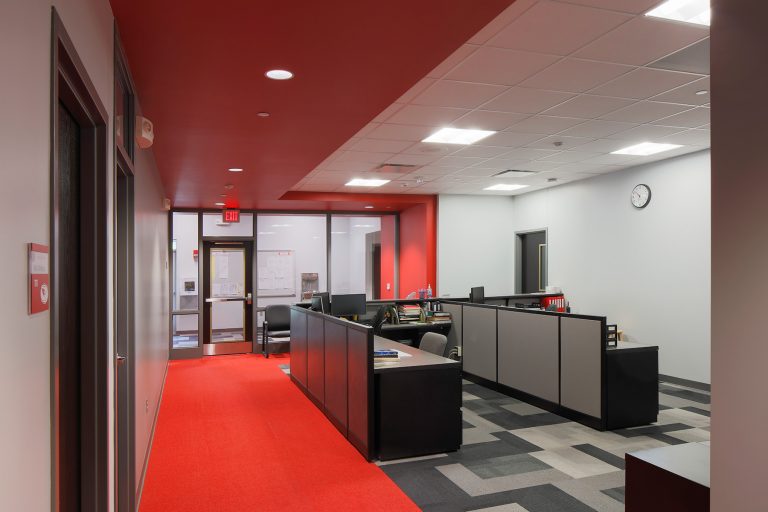 Office with red carpet and ceiling elements