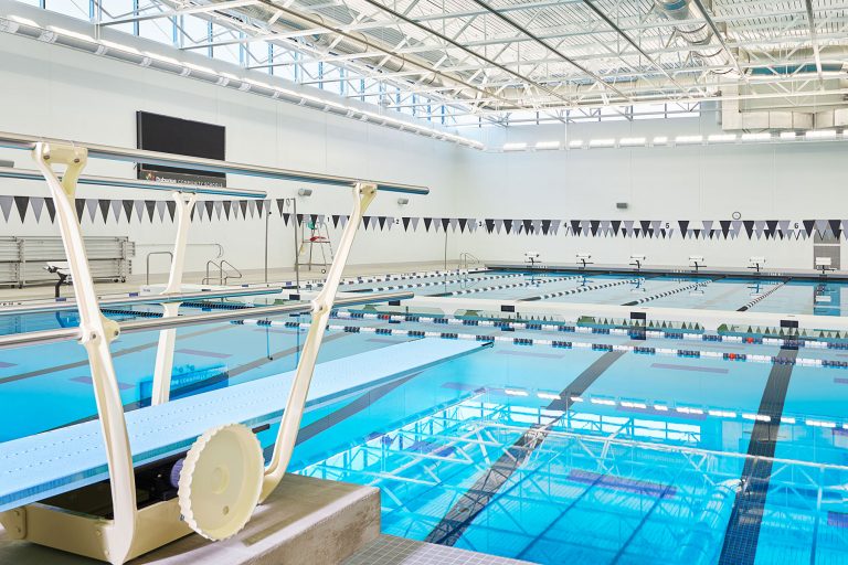 Pool with diving board in foreground