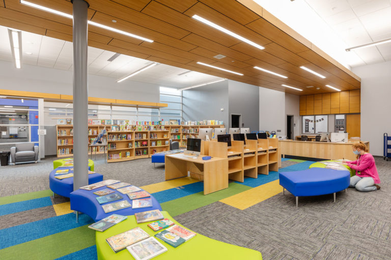 Media center with wood panel ceiling detail