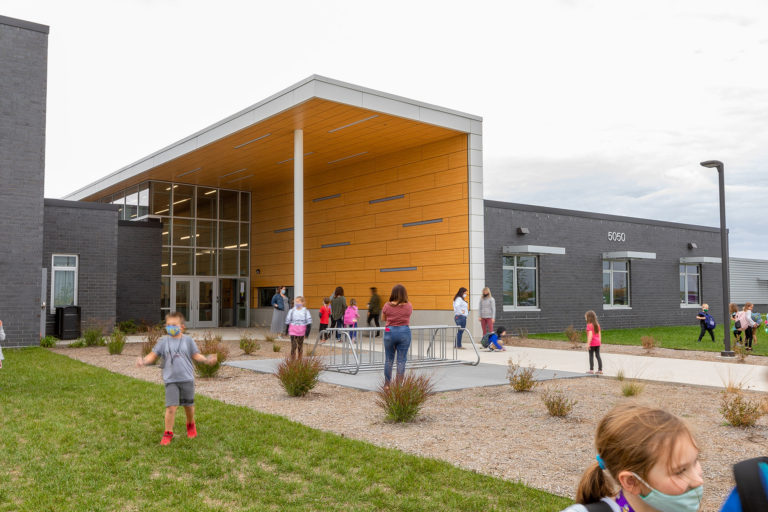 Exterior entry facade with wood