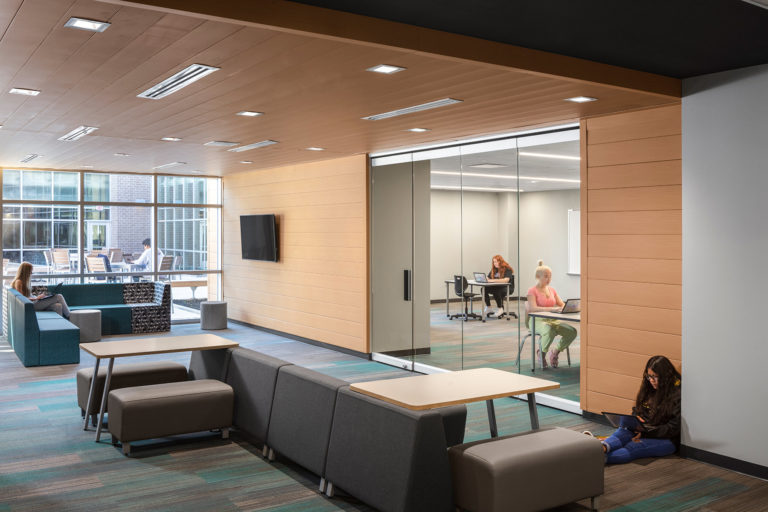 Breakout space between classrooms with soft seating