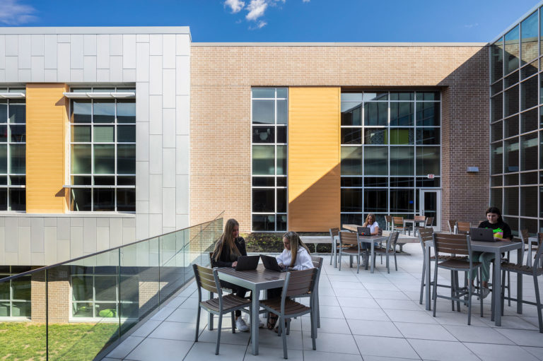 Exterior balcony space with tables