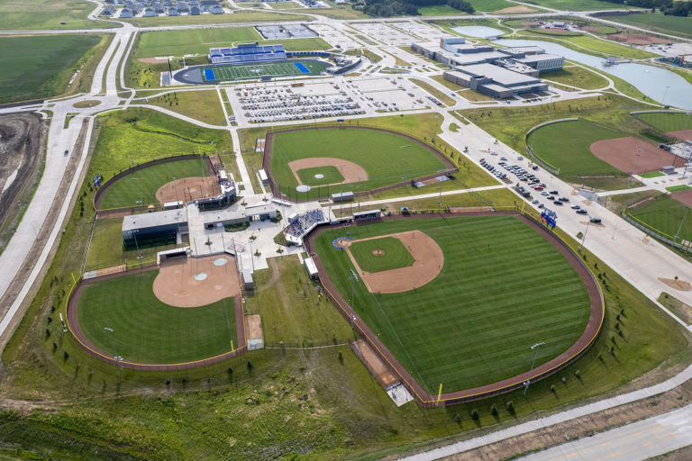 Aerial image of baseball fields, football field, and high school