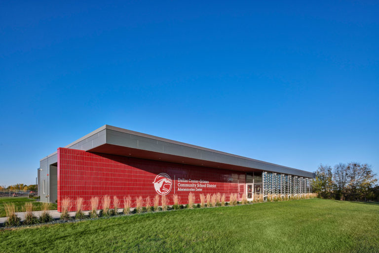 Overall exterior view highlighting red entrance wall