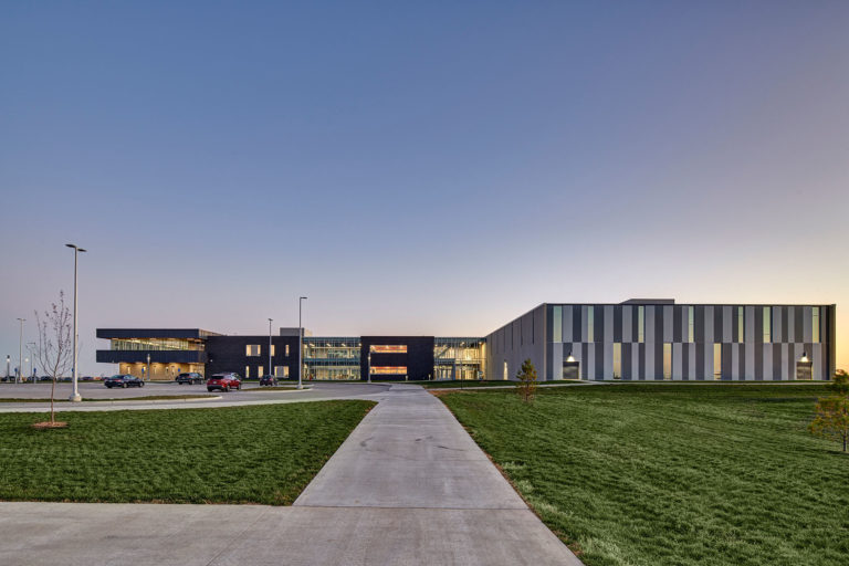 Overall exterior view of building at dusk