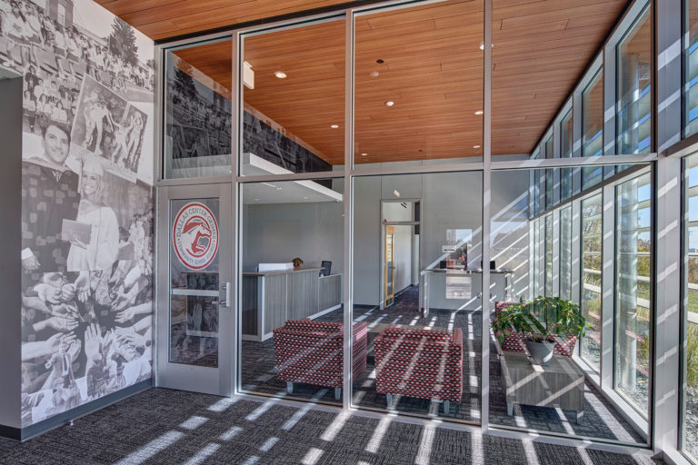 View looking into reception area featuring photo wall