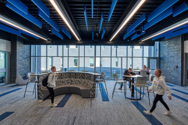 Collaboration space outside classrooms with blue accents