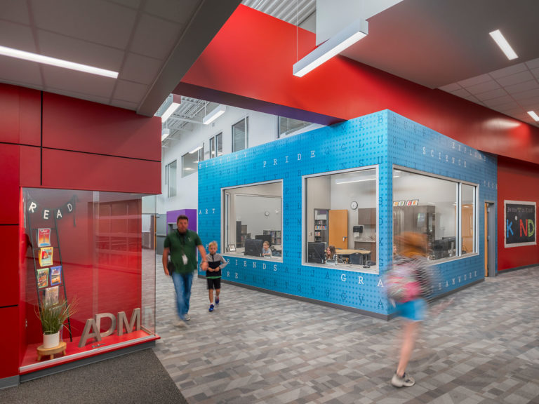 Interior entry with red continuing on ceiling and blue projected box