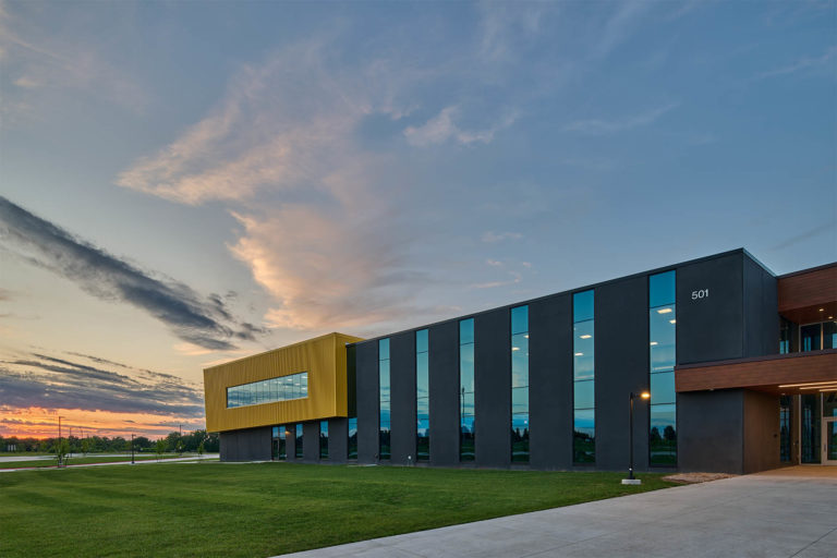 Exterior at dusk with reflections in windows
