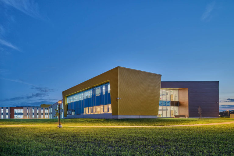 Exterior dusk with yellow classroom block
