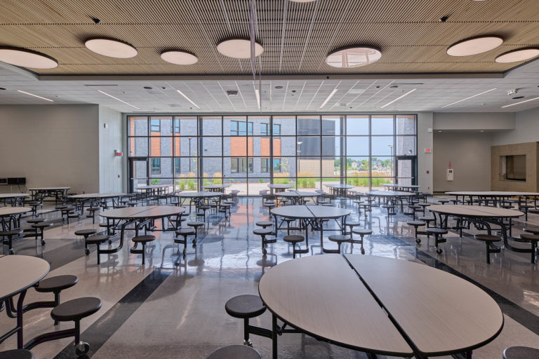 Commons / cafeteria with wood ceiling and round light fixtures