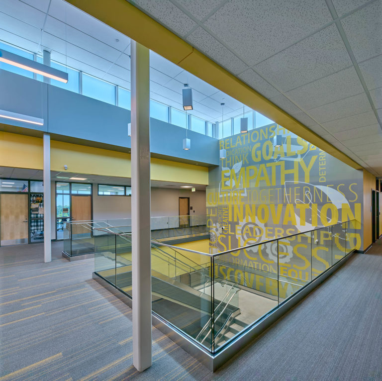 Main stair with yellow wall graphic
