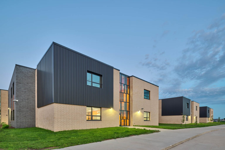 Exterior classroom pod with orange stair tower