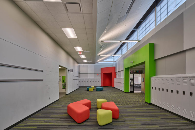 classroom pod featuring color-matched accent walls and furniture